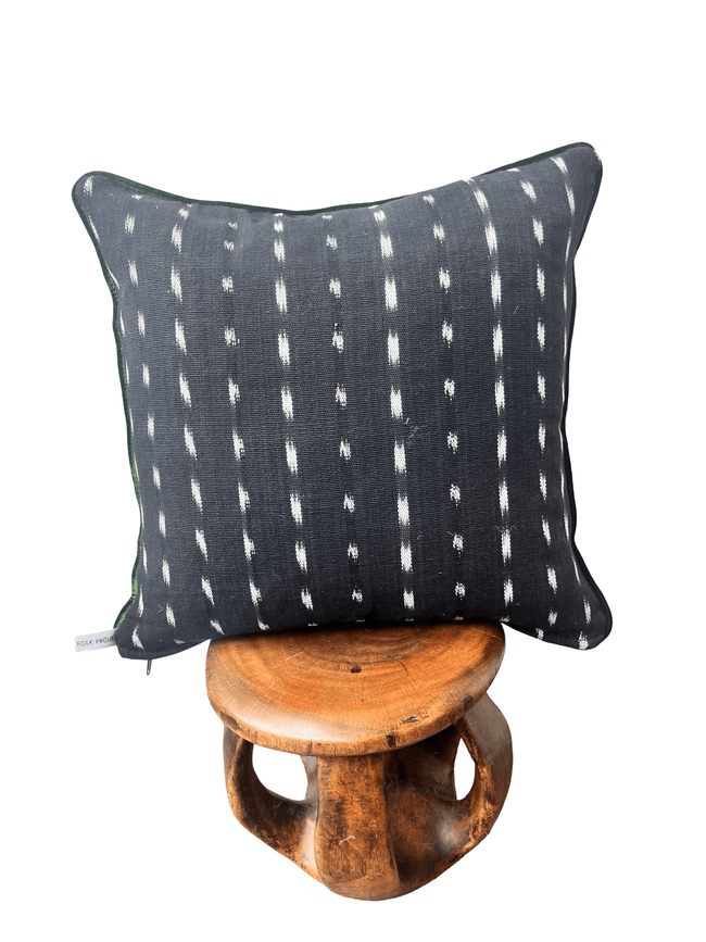 Handcrafted pillow made from colorful huipil remnants in a radial starburst pattern.- FolkProject