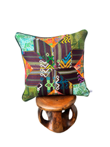 Handcrafted pillow made from colorful huipil remnants in a radial starburst pattern. - FolkProject