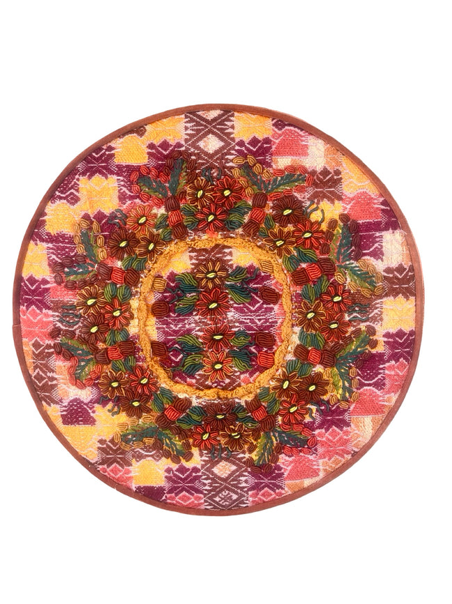 Round footstool upholstered in colorful Guatemalan huipil with rich caramel Belgian velvet piping- FolkProject