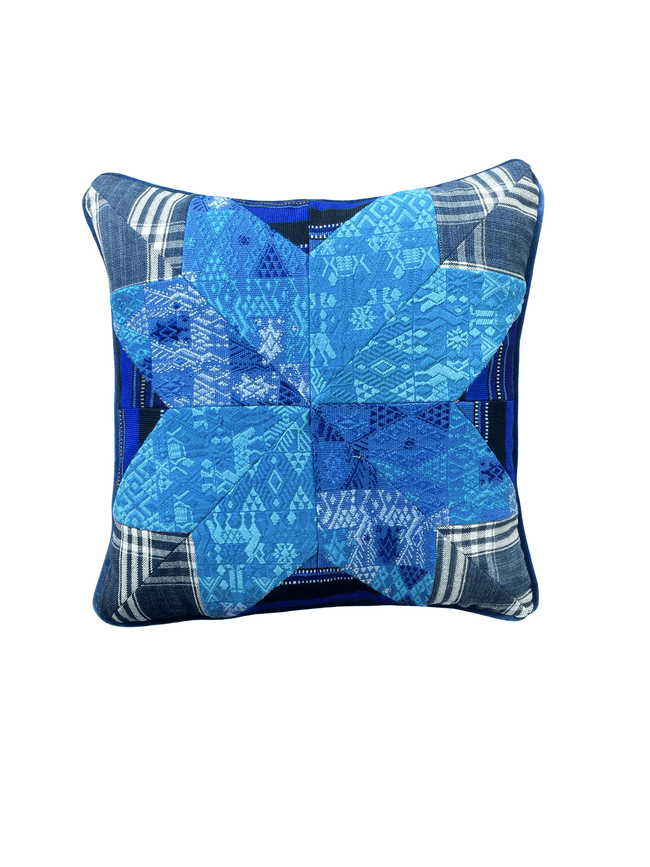Handcrafted pillow made from colorful huipil remnants in a radial starburst pattern.- FolkProject