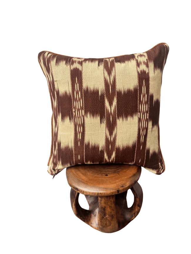 Handcrafted pillow made from colorful huipil remnants in a radial starburst pattern.- FolkProject