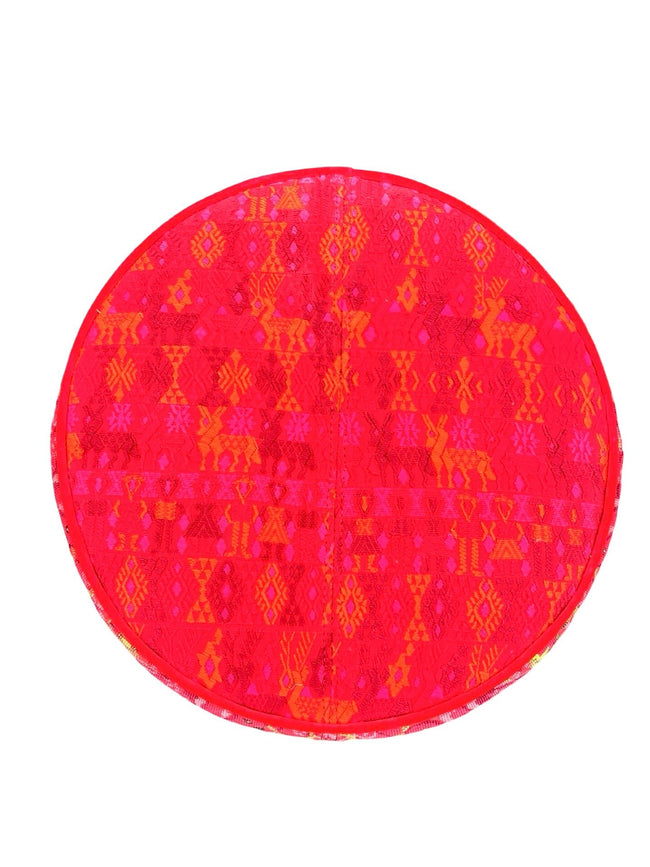 Round footstool upholstered in colorful Guatemalan huipil with vibrant red Belgian velvet piping- FolkProject
