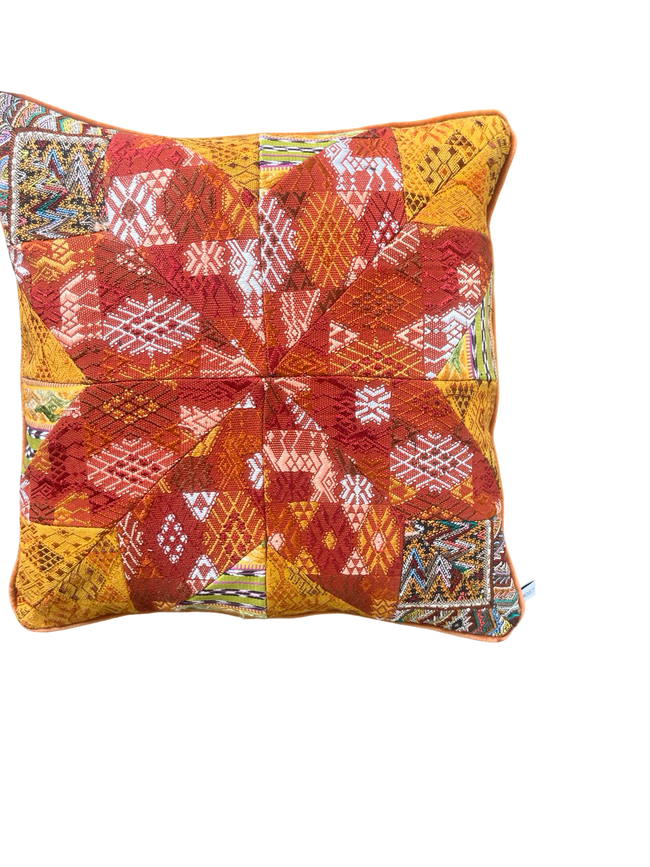 Handcrafted pillow made from colorful huipil remnants in a radial starburst pattern. - FolkProject