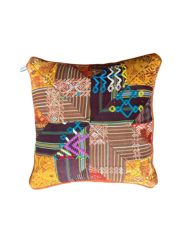 Handcrafted pillow made from colorful huipil remnants in a radial starburst pattern.- FolkProject