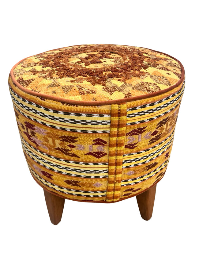 Iraci mustard round footstool upholstered in colorful Mexican and Guatemalan huipiles with mustard velvet piping- FolkProject
