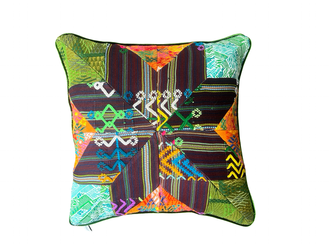 Handcrafted pillow made from colorful huipil remnants in a radial starburst pattern.- FolkProject