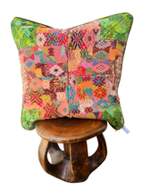 Handcrafted pillow made from colorful huipil remnants in a radial starburst pattern
- FolkProject