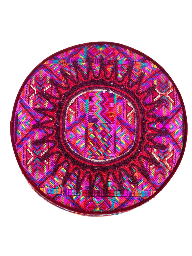 Iraci multicolor round footstool upholstered in colorful Mexican and Guatemalan huipiles with  velvet piping - FolkProject
