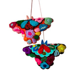 Hand-embroidered moth ornament from Chiapas-Mexico featuring colorful traditional textile patterns.