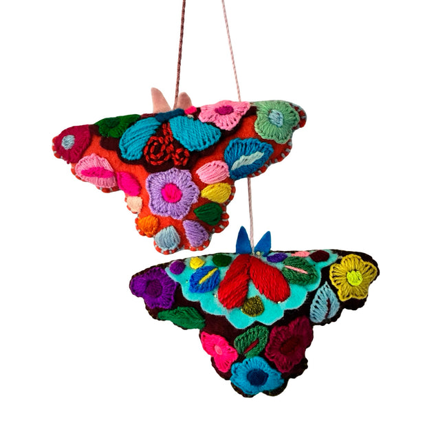 Hand-embroidered moth ornament from Chiapas-Mexico featuring colorful traditional textile patterns.