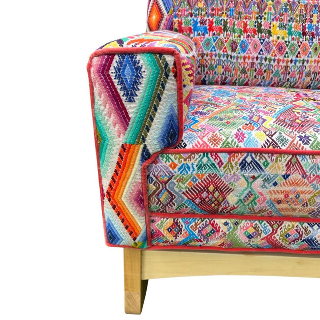Malia handcrafted rocking chair upholstered in colorful Guatemalan huipil, corte, and handwoven ikat textiles. - FolkProject